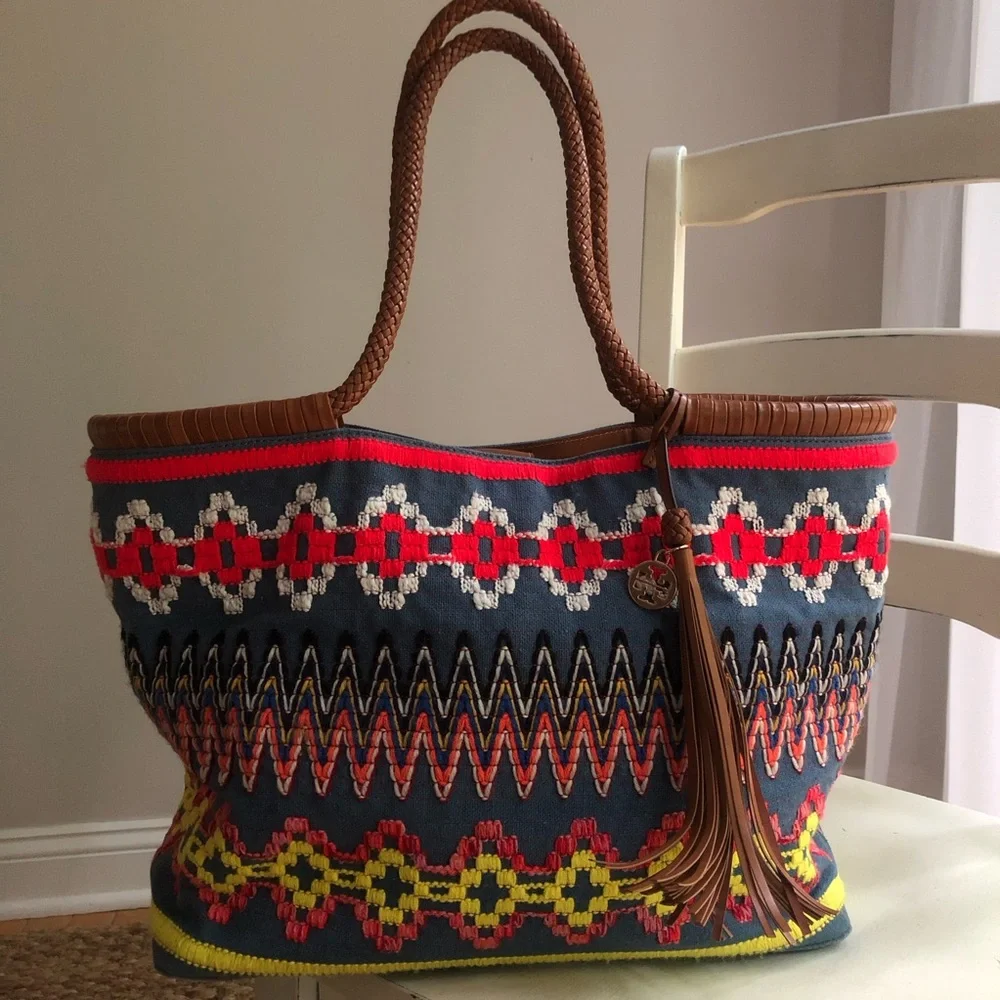 Tory Burch measured approximately